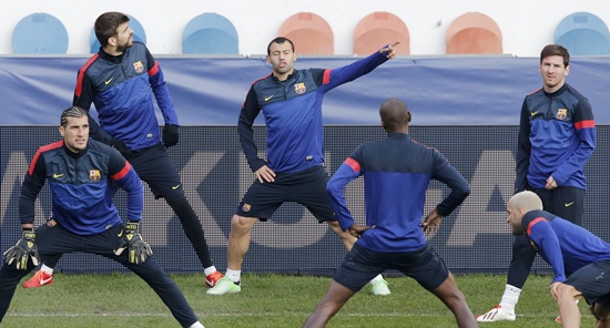 Barcelona's players including Lionel Messi (right) attend a training session