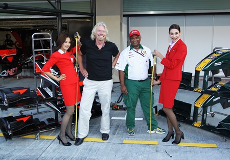 Sir Richard Branson of Virgin GP and Tony Fernandes of Lotus in the paddock before qualifying for the Abu Dhabi F1 GPon November 13, 2010