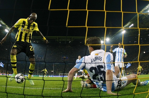 Borussia Dortmund's Felipe Santana (left) scores a third and winning goal