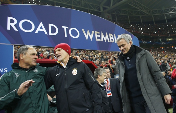 Real Madrid's coach Jose Mourinho (right) walks off