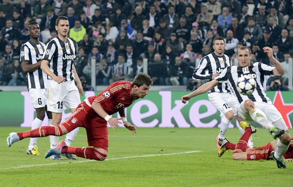 Bayern Munich's Mario Mandzukic (centre) scores against Juventus