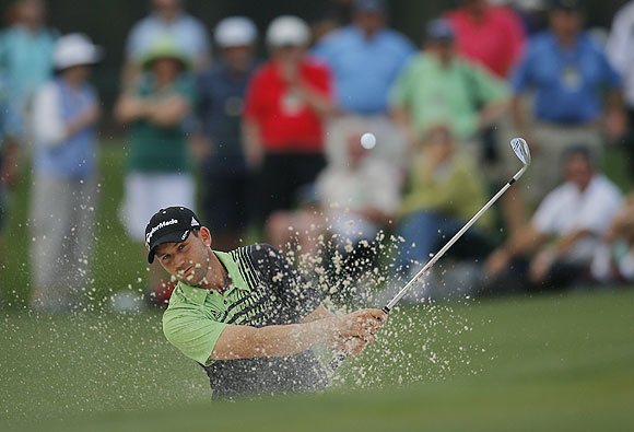 Sergio Garcia of Spain hits from a sand trap on the 17th green during first round play in the 2013 Masters golf tournament at the Augusta National Golf Club in Augusta, Georgia, on Thursday