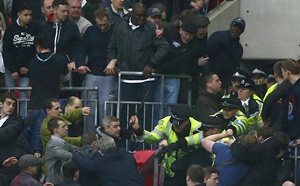 Millwall fans fight with police officers