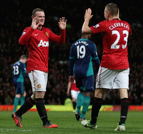 Wayne Rooney of Manchester United is congratulated by Tom Cleverley