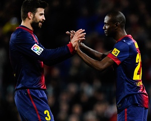 Eric Abidal of FC Barcelona comes on for Gerard Pique
