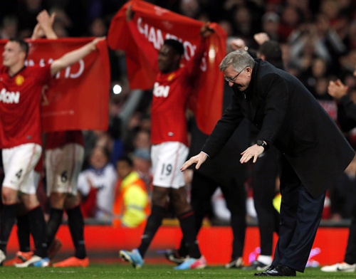 Manchester United's manager Alex Ferguson celebrates after his   team clinched the English Premier League title on Monday