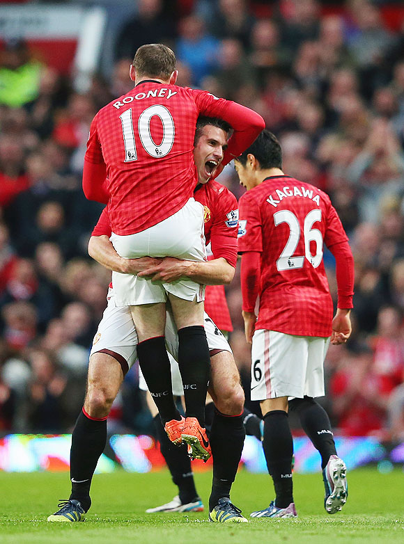 Manchester United's Robin van Persie celebrates with Wayne Rooney after scoring against Aston Villa on Monday