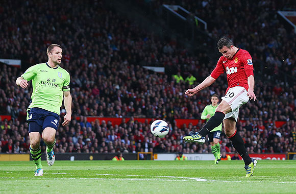Manchester United's Robin van Persie scores his team's second goal against Aston Villa at Old Trafford on Monday