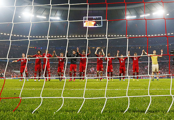 Bayern Munich's players celebrate after beating Barcelona 4-0 on Tuesday