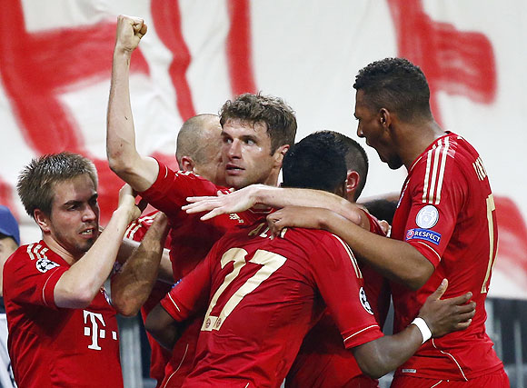 Bayern Munich's Thomas Mueller (centre) celebrates with teammates after scoring against Barcelona on Tuesday