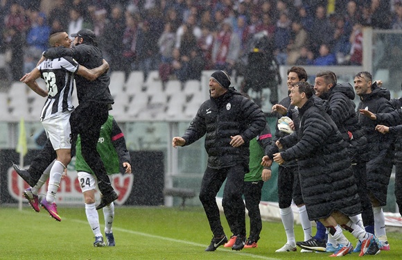 Juventus' Arturo Vidal (left) celebrates with his coach Antonio Conte