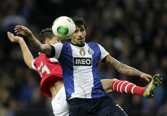 Porto's Lucho Gonzalez (right) battles for the ball