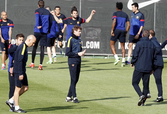 Barcelona's coach Tito Vilanova (centre) is surrounded by his players
