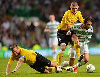 Georgios Samaras of Celtic takes on Anders Svensson and Jon Jonsson of Elfsborg during their UEFA Champions League third qualifying round first leg match at Celtic Park Stadium in Glasgow, Scotland, on Wednesday