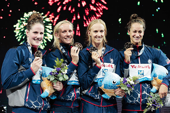 1 (Left-Right) Gold medal winners Missy Franklin, Jessica Hardy, Dana Vollmer and Megan Romano of the USA celebrate on the podium after the Women's Medley 4x100m relay final in Barcelona, Spain, on Sunday