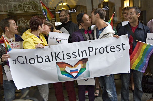 Protesters kiss outside the Russian Consulate in Vancouver