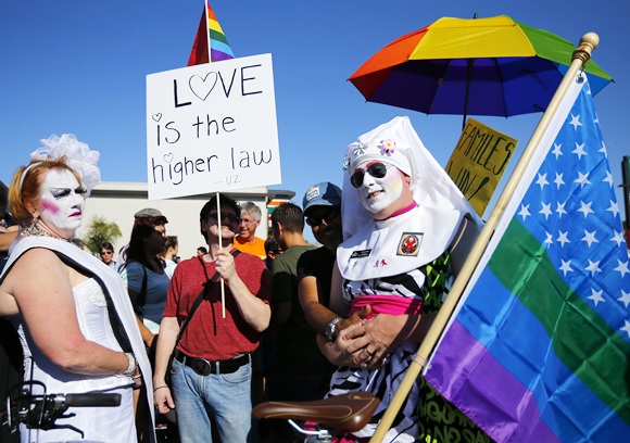 People dress up as they attend   a rally in support of the United States Supreme Court decision on marriage rights in San Diego