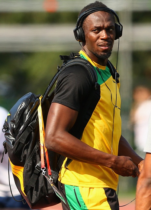 Usain Bolt of Jamaica walks across the Northern Arena training track ahead of the 14th IAAF World Athletics Championships Moscow 2013