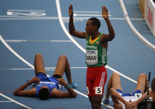 Mohammed Aman (C) of Ethiopia reacts to winning his men's 800 metres heats during the IAAF World Athletics Championships 