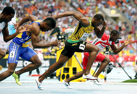 Usain Bolt (2nd right) during the 100 metres heat
