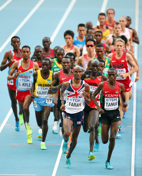 Mo Farah of Great Britain (left) and Paul Kipngetich Tanui of Kenya lead the men's 10,000m final