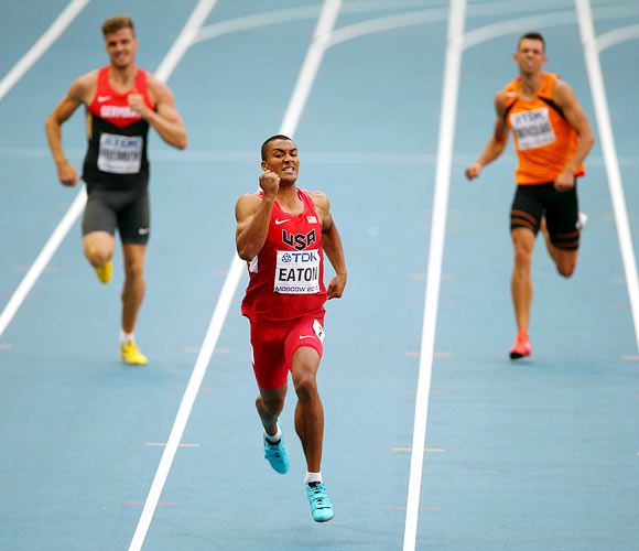 Ashton Eaton (centre) of the United States competes in the men's decathlon 400 metres