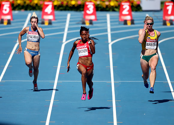 (Left to right): Martina Pretelli of San Marino, English Gardner of the United States and Melissa Breen of Australia compete in the Women's 100 metres heats
