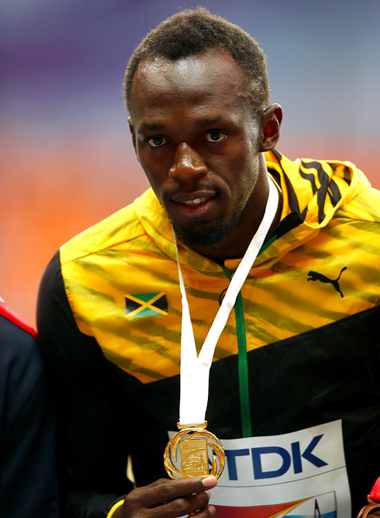 Gold medalist Usain Bolt on the podium during the medal ceremony for the men's 100 metres