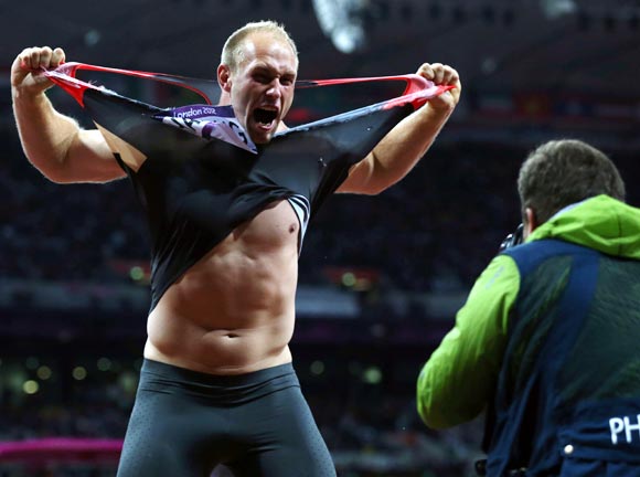 Robert Harting of Germany celebrates winning gold in the Men's Discus Throw final at the 2012 London Olympics