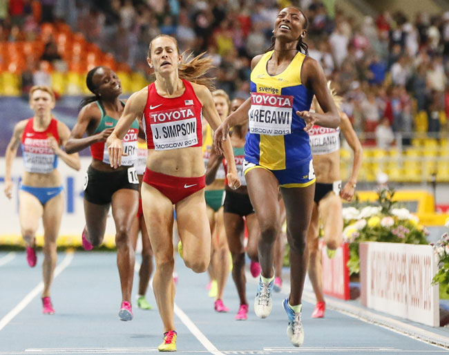Abeba Aregawi (right) of Sweden runs to win ahead of second placed Jennifer Simpson of the U.S. during the women's 1500 metres final 