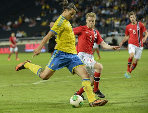 Sweden's Zlatan Ibrahimovic (front) controls the ball against Norway's Tom Hogli during their international friendly soccer match