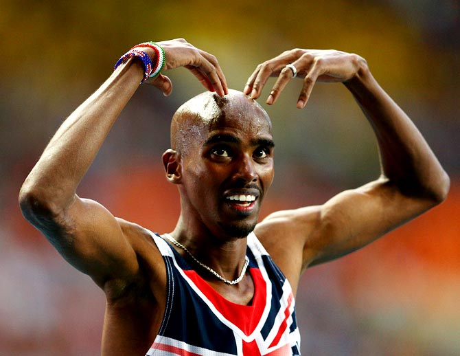 Mo Farah of Great Britain celebrates winning gold in the men's 5000 metres