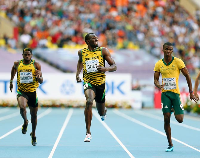 Usain Bolt of Jamaica (centre) competes in the men's 200 metres semi-finals