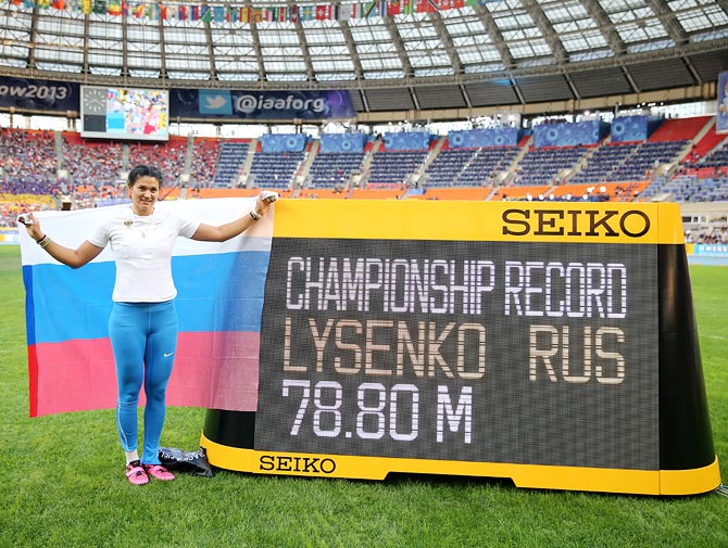 Tatyana Lysenko of Russia celebrates after breaking the championship record and winning gold in the women's hammer throw