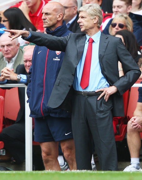 Arsenal manager Arsene Wenger (right) talks to assistant manager Steve Bould