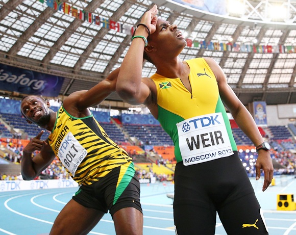 Usain Bolt celebrates with Warren Weir