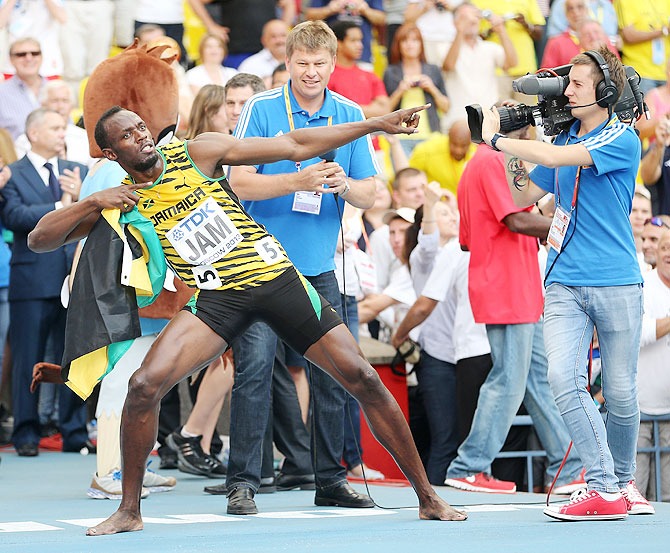 Usain Bolt of Jamaica celebrates winning gold in the Men's 4x100 metres final on Sunday