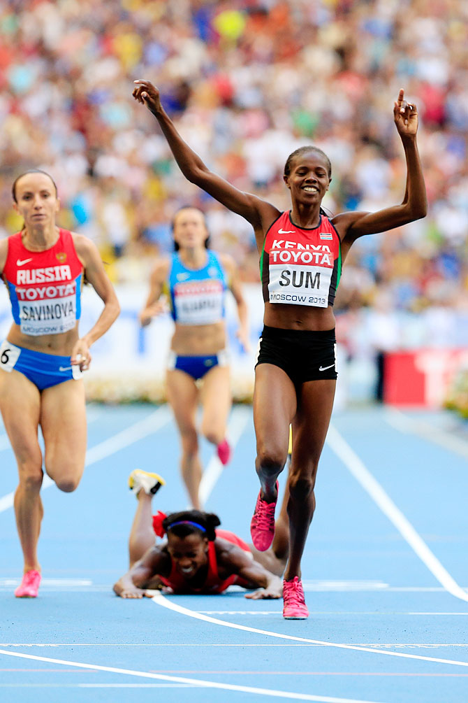 Alysia Johnson Montano of the United States falls over at the line AS Eunice Jepkoech Sum of Kenya crosses the line to win gold in the Women's 800 metres final on Sunday