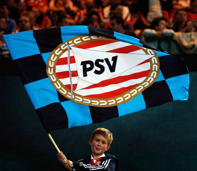 PSV fans show their support during the UEFA Champions League Play-off First Leg match against AC Milan