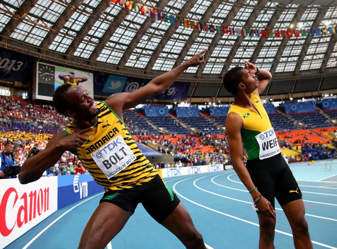 Usain Bolt celebrates with Warren Weir