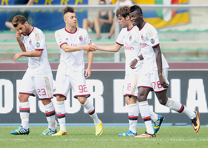 Andrea Poli of AC Milan celebrates with teammates after scoring against Hellas Verona FC during their Serie A match on Saturday