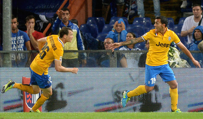 Carlos Tevez of Juventus (right) celebrates scoring the first goal during the Serie A match against Sampdoria