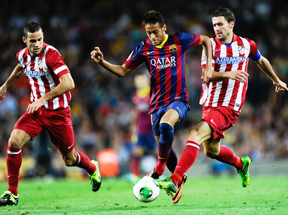 Neymar (centre) of FC Barcelona duels for the ball with Mario Suarez (right) and Gabi Fernandez of Atletico de Madrid 
