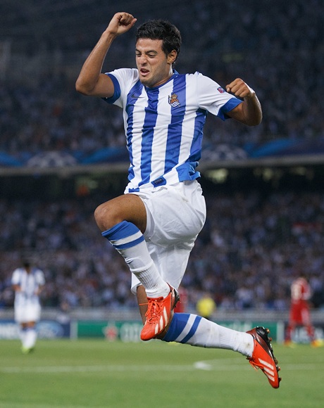 Carlos Vela of Real Sociedad jumps while celebrating scoring