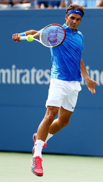 Roger Federer of Switzerland returns a shot