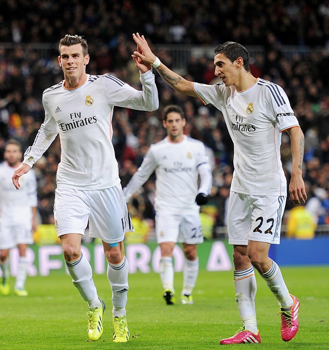 Gareth Bale of Real Madrid CF celebrates with Angel Di Maria