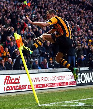 David Meyler of Hull City celebrates scoring his team's second goal against Liverpool during their English Premier League match at KC Stadium in Hull, England on Sunday