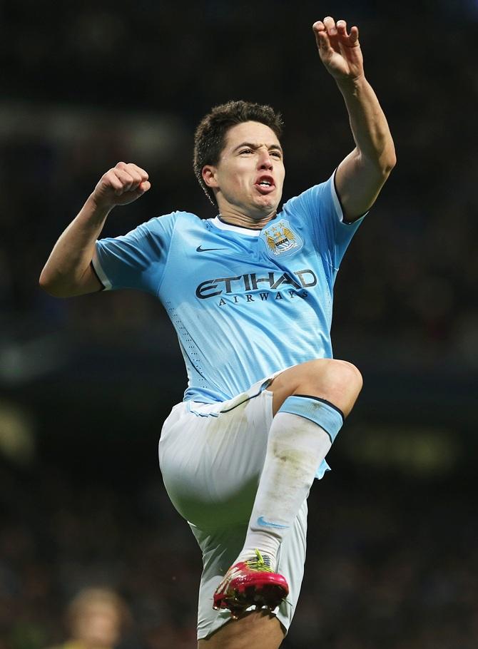 Samir Nasri of Manchester City celebrates his team's third goal against Swansea City