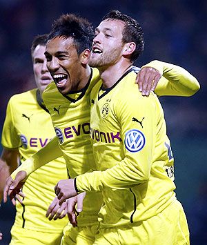 Julian Schieber (right) and Aubameyang (centre) of Borussia Dortmund celebrate Schieber's goal against third division club FC. Saarbruecken