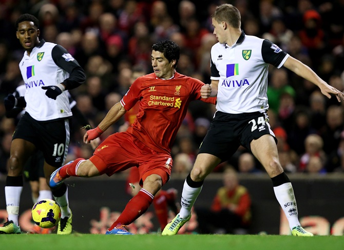 Luis Suarez of Liverpool scores